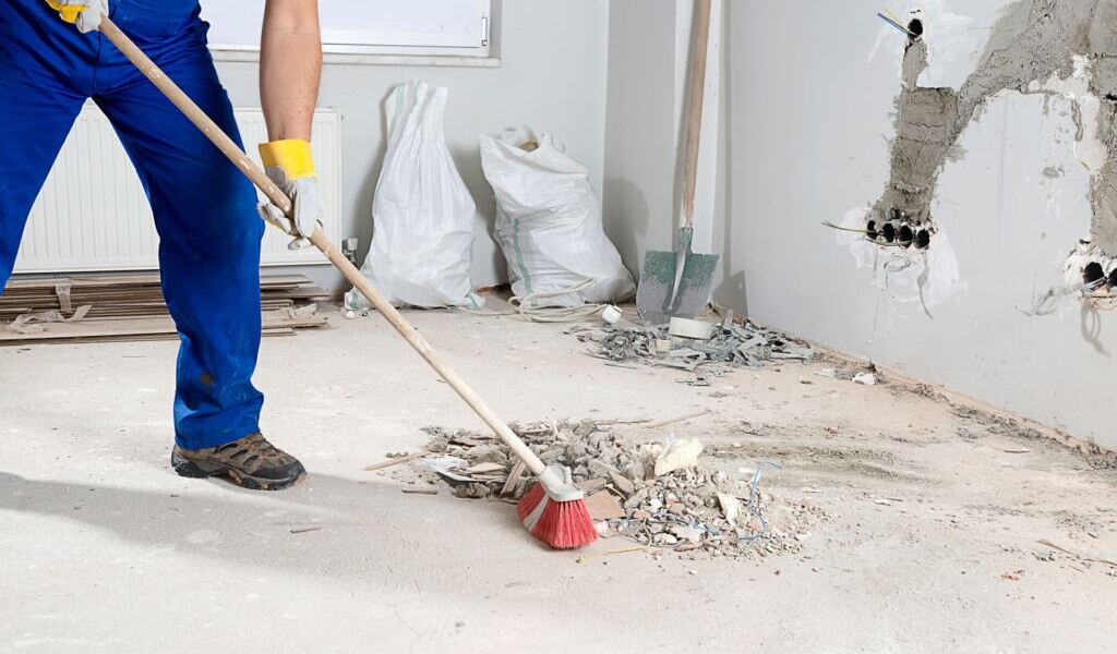 post construction cleaning staff sanitizing desks and vacuuming carpets inside a modern Southwest Florida office workspace