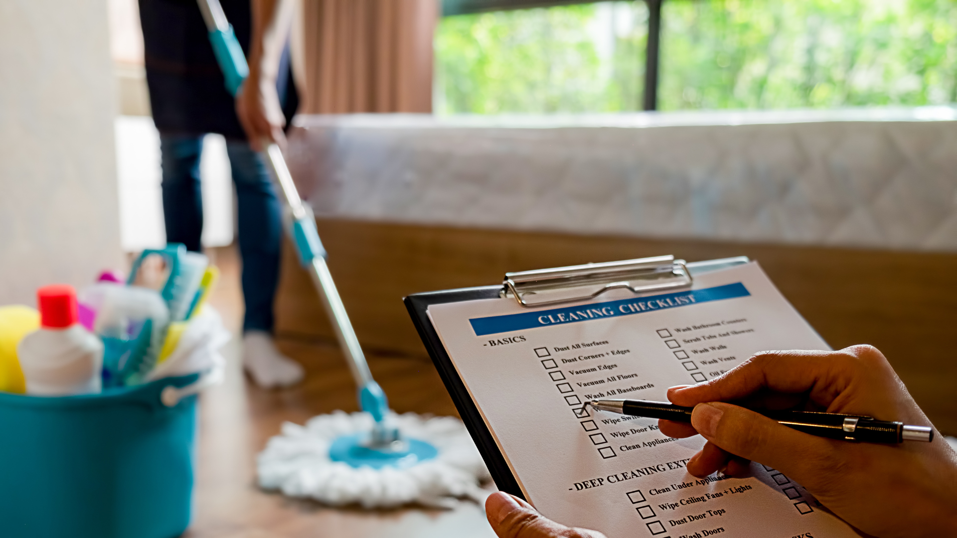 Residential cleaning team carefully dusting furniture and wiping surfaces inside a bright Southwest Florida family living room